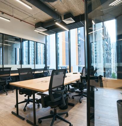Interior photo office in loft with transparent partition and furniture Interior photo of office decoration in loft style with transparent partition and functional furniture